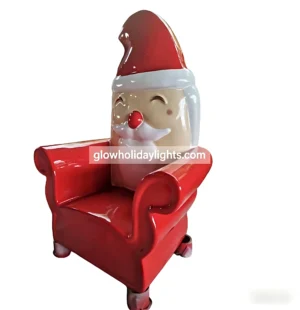 Adorable red Santa-themed armchair with a cheerful smiling face and classic hat design. Made of durable fiberglass, perfect for Christmas photo ops, mall displays, or festive home decor to add a joyful holiday vibe.