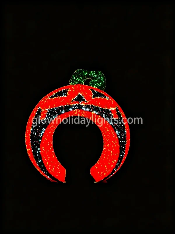 Glowing jack-o'-lantern arch LED motif light, perfect for Halloween decor. Features a bright red pumpkin face with a green stem, ideal for entrances, yards, and event spaces to create a spooky festive atmosphere.